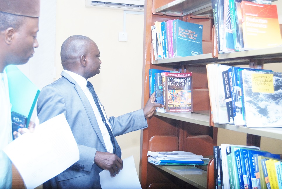 The Vice-Chancellor, Prof. Kolawole Salako, inspecting some sets of books on display in the CEADESE library