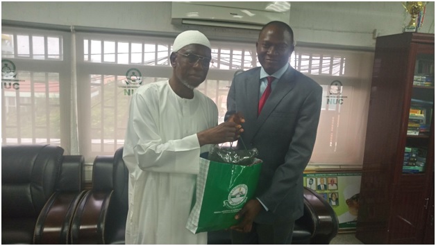 Prof. Olukayode Akinyemi while handing over Souvenir to Prof. Abubakar Rasheed